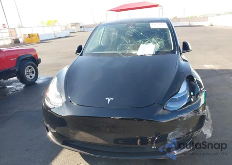 2025 Tesla Model Y from USA, damaged, VIN 7SAYGDED1SF217131